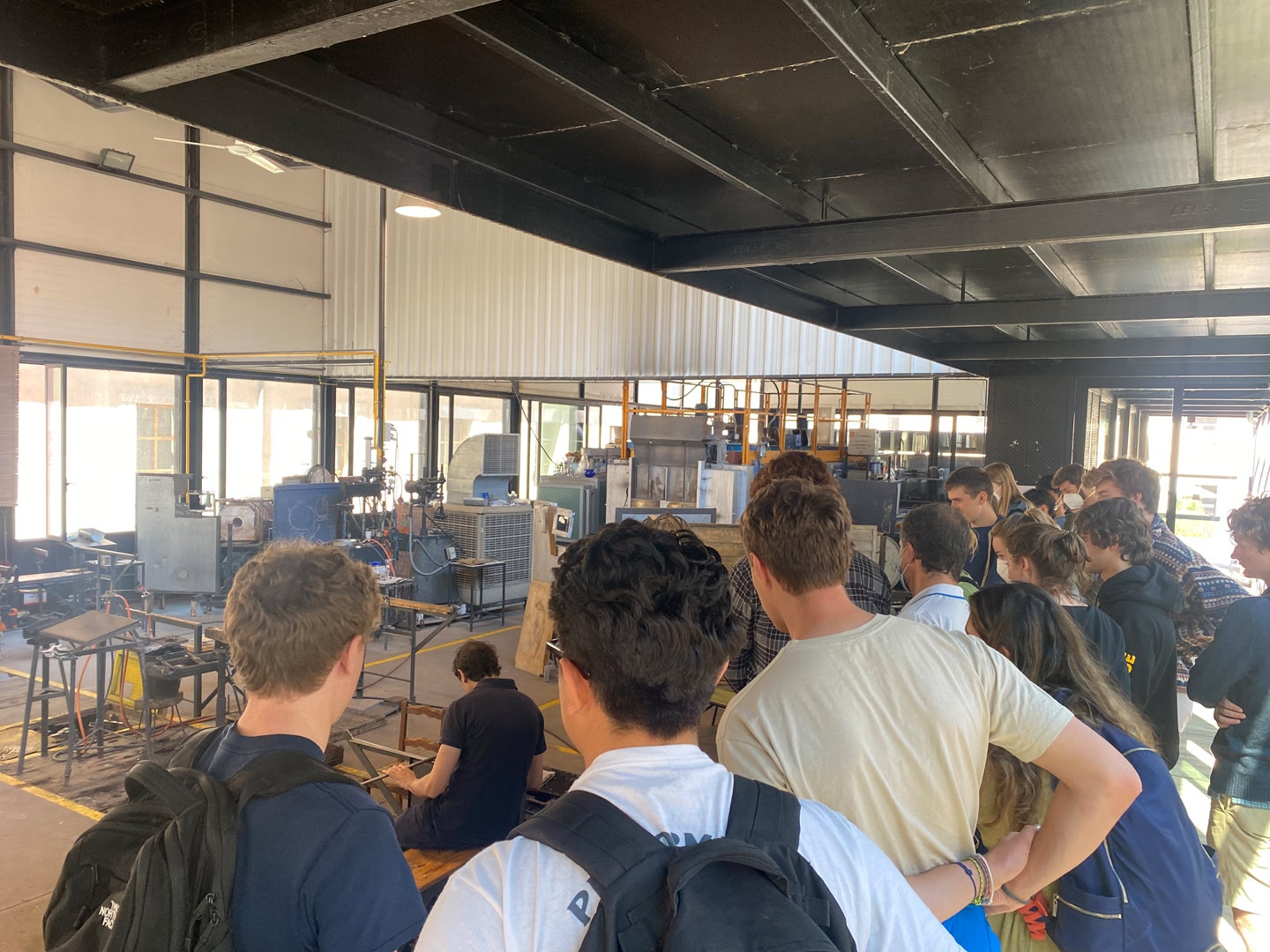 Students observe a glassblower create a stunning glass vase at the Royal Crystal Factory of La Granja, in San Ildefonso, Spain. Photo by Zeke Lloyd ’24